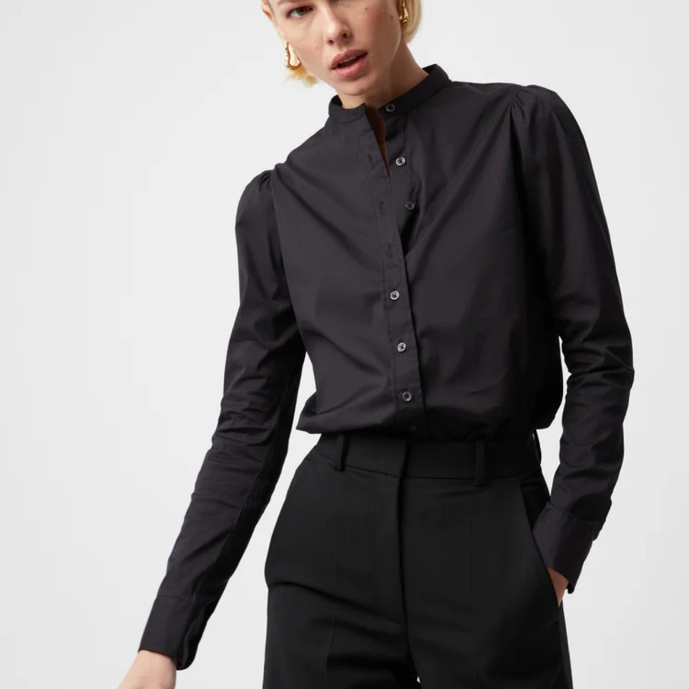 The Shirt by Rochelle Behrens black puff shoulder shirt.